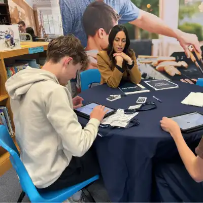 Volunteer talking to a student